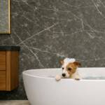 Large Romagna Graphite Quartz - 1m x 2.4m Shower Panel shown in bathroom with bath