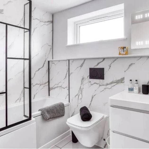 Matt White Marble 1m shower wall panel with natural white base and light/dark grey veining in bathroom